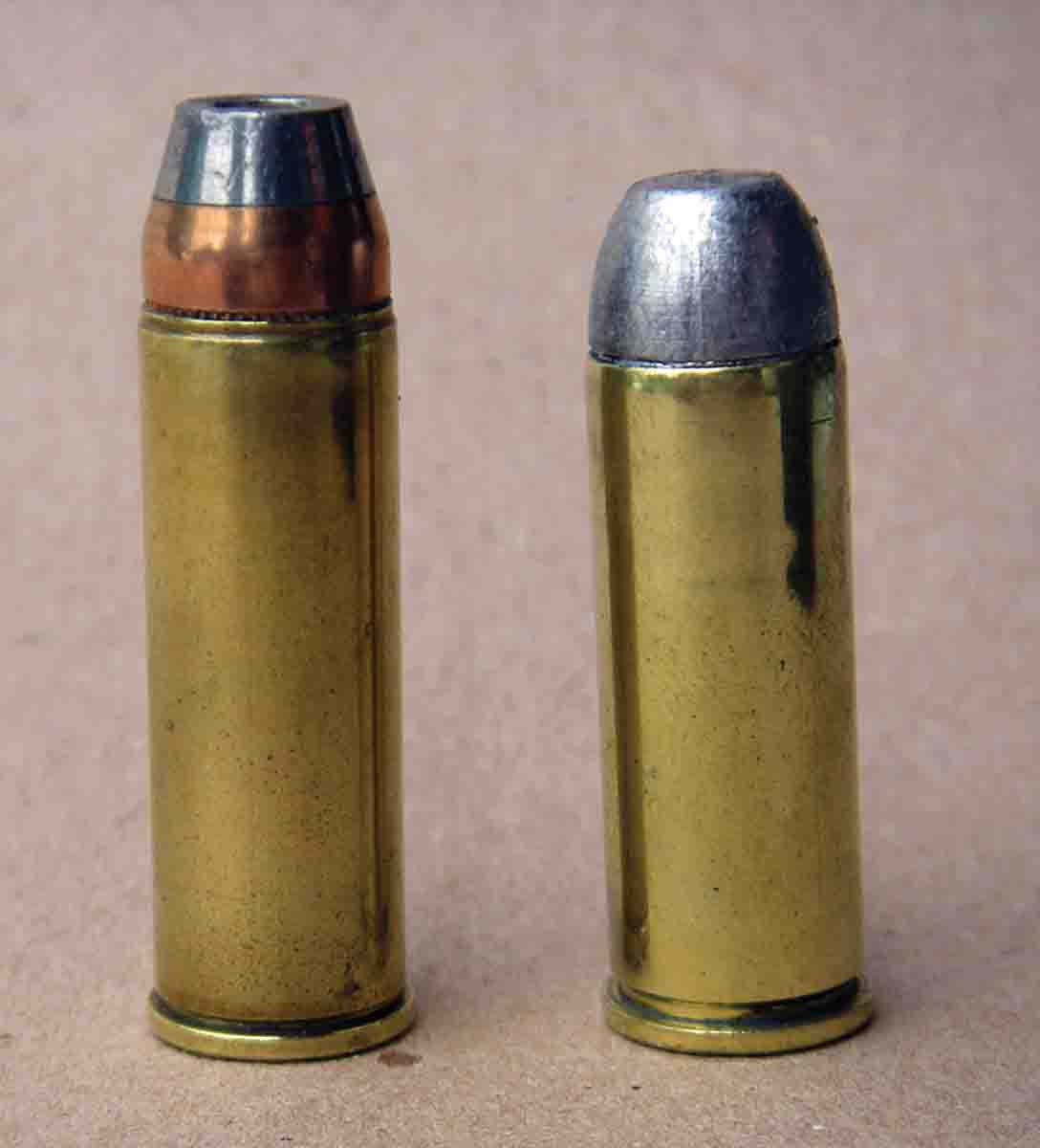 The .454 Casull (left) is based on a lengthened .45 Colt cartridge (right) but is loaded to substantially greater pressures.